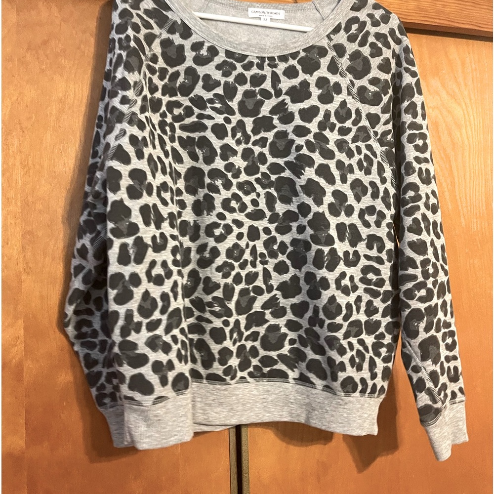 Grayson Threads sweater top. Not very think but is warm. Super comfortable.